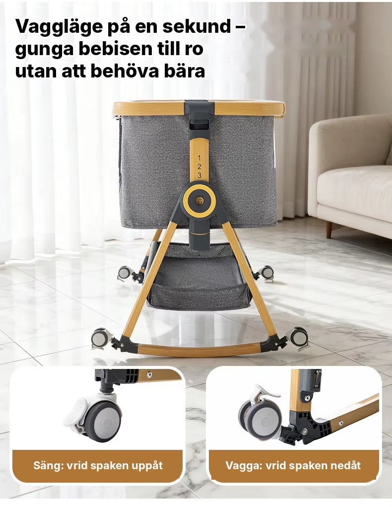 Hjulen på Bedside Crib Vyssa fälls undan så att sängen vilar på vaggmedar och kan gungas